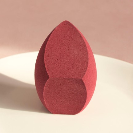 Slanted irregularly shaped makeup sponge