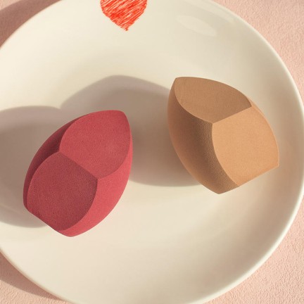 Slanted irregularly shaped makeup sponge