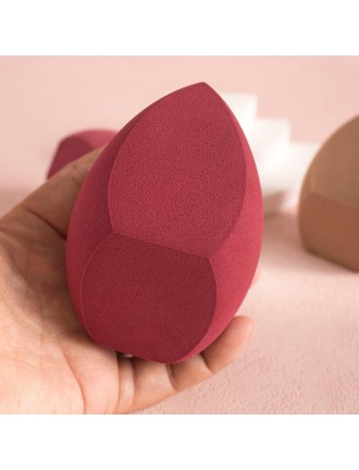 Slanted irregularly shaped makeup sponge